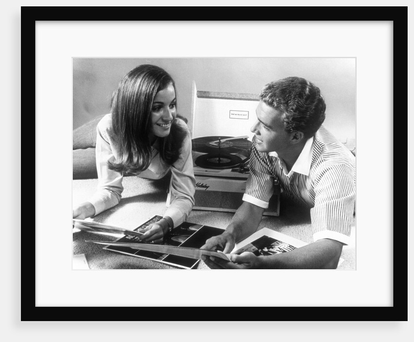 1960s Teen Couple Playing Lp Vinyl Records On Portable Phonograph by Anonymous