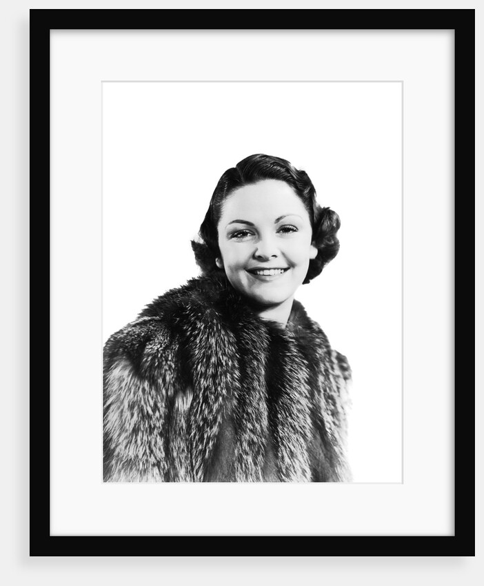 1930s 1940s Portrait Smiling Woman Wearing Fur Coat Looking At Camera by Anonymous