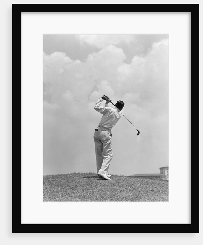 1930s Man Playing Golf Teeing-off Golf Ball From Tee With Driver Outdoor by Anonymous