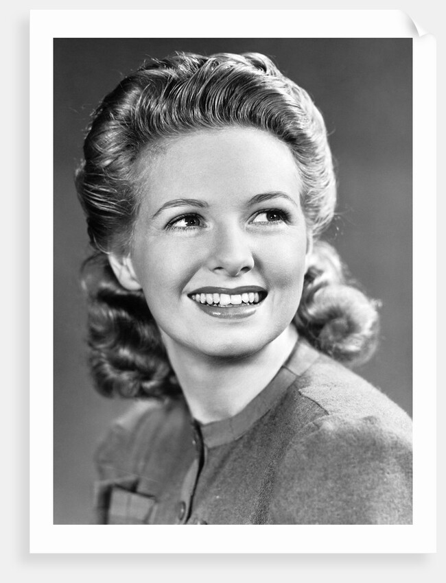 1940s Portrait Of Smiling Woman With Long Blond Curly Hair by Anonymous