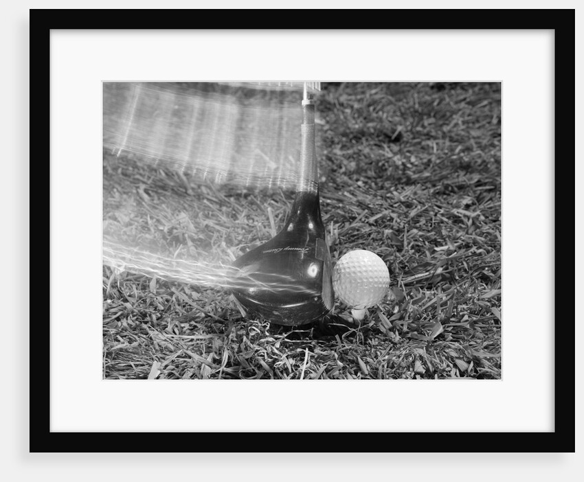 1960s Moving Driver Golf Club Hitting Ball On Tee In Grass by Anonymous