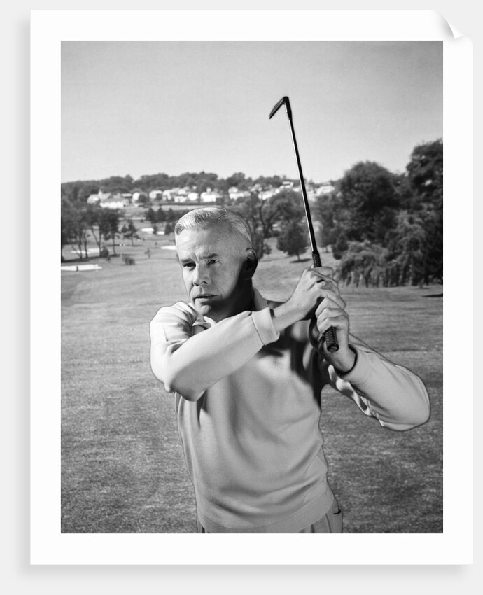 1960s Man Playing Golf Hitting Golf Ball From Fairway With Iron Club by Anonymous