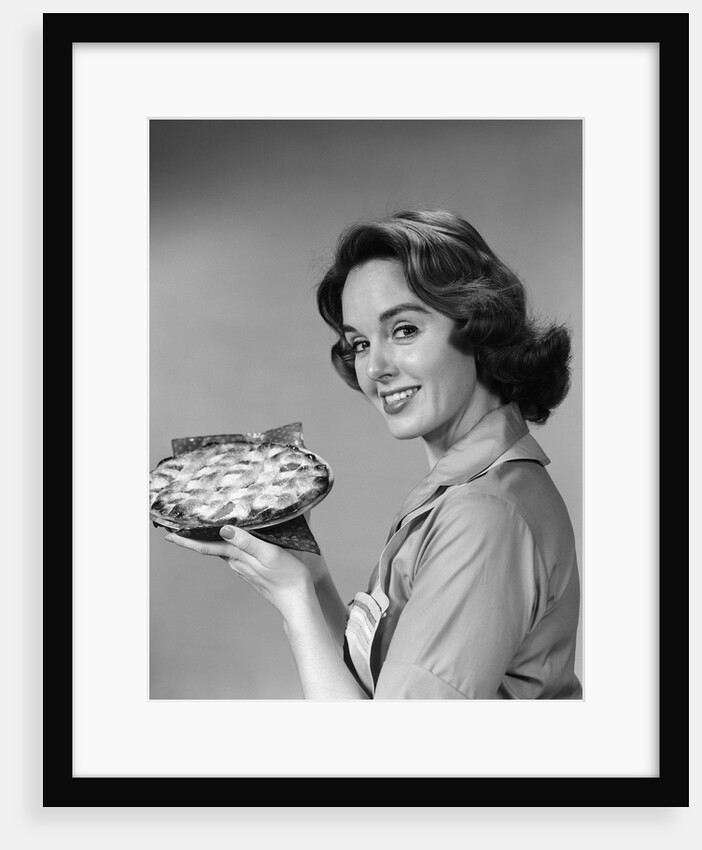 1950s 1960s Smiling Woman Holding Freshly Baked Pie Looking At Camera by Anonymous