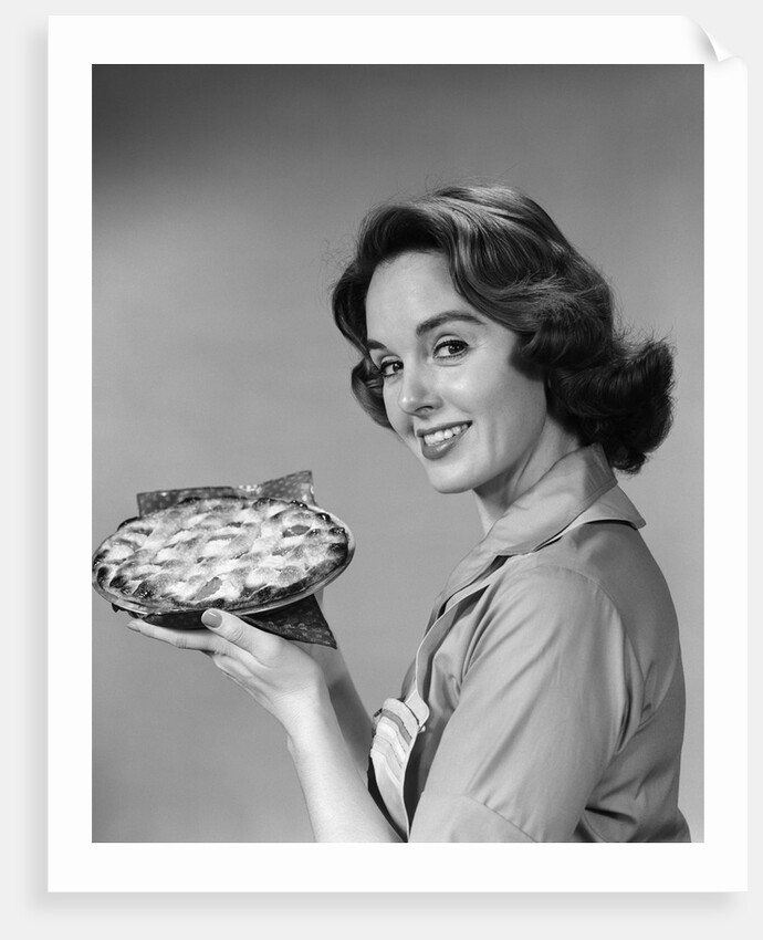 1950s 1960s Smiling Woman Holding Freshly Baked Pie Looking At Camera by Anonymous