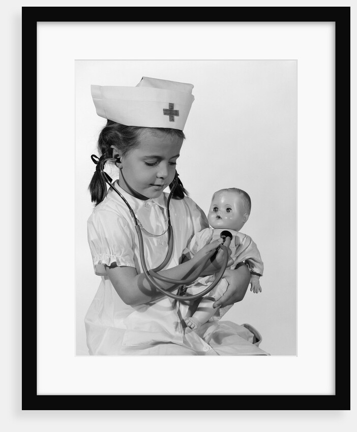 1960s Girl In Nurse Uniform Holding Stethoscope To Baby Doll Chest Indoor by Anonymous
