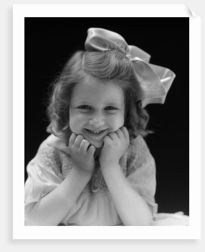 1930s Portrait Smiling Brunette Girl With Big Ribbon Bow In Her Hair Looking At Camera by Anonymous