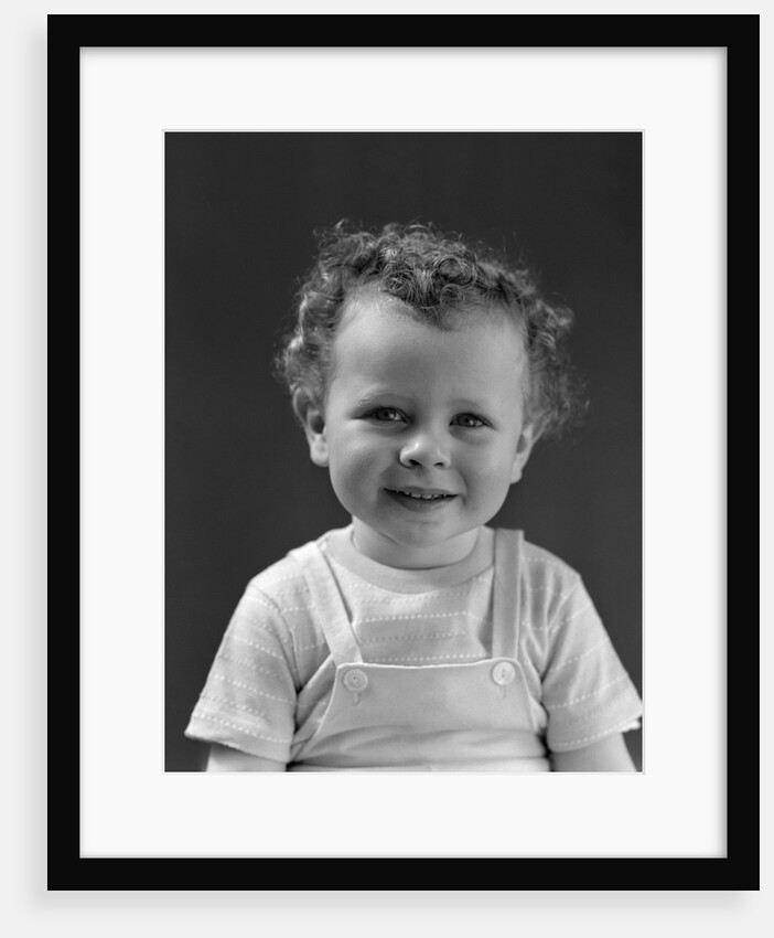 1940s Curly Haired Little Boy Portrait Smiling Looking At Camera by Anonymous