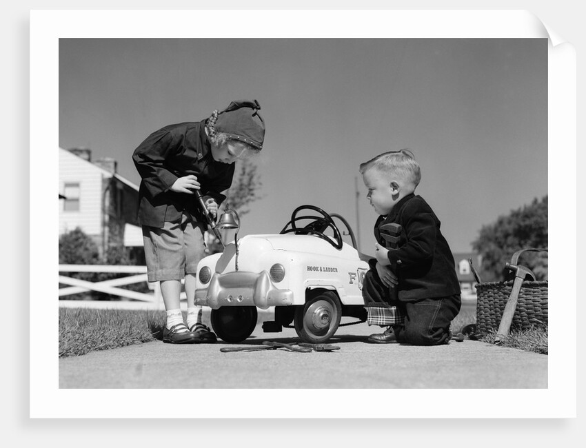 1950s Boy And Girl Playing At Repairing Toy Car by Anonymous
