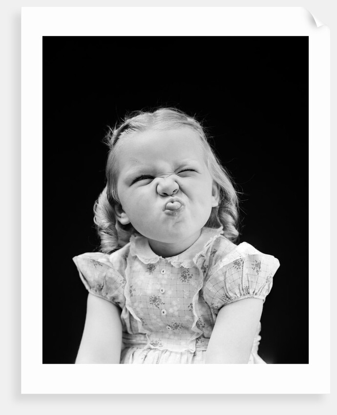 1940s Portrait Of Girl Sticking Out Tongue Wrinkled Up Nose by Anonymous