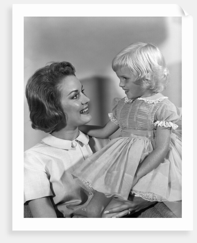 1960s Mother Holding Little Blond Girl Wearing Fancy Dress In Her Arms Looking At Each Other by Anonymous