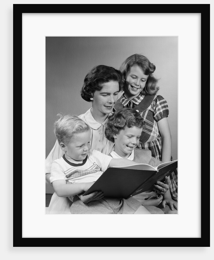 1950s Portrait Mother Two Daughters And Son Reading Book Together by Anonymous