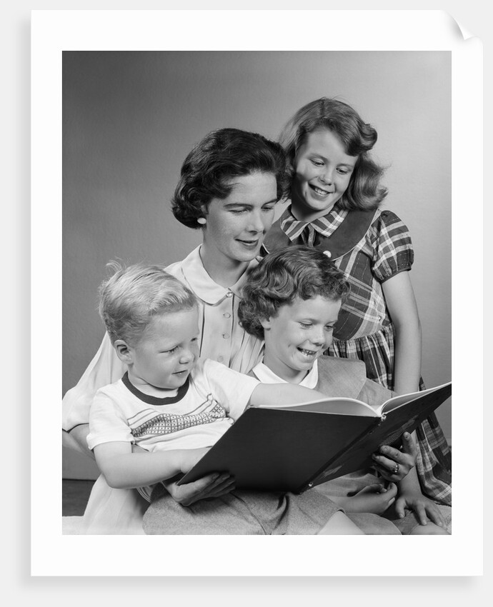 1950s Portrait Mother Two Daughters And Son Reading Book Together by Anonymous