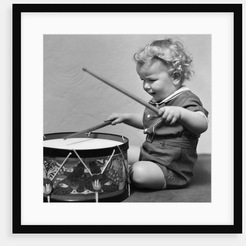 1930s Toddler Boy Playing Toy Drum by Anonymous