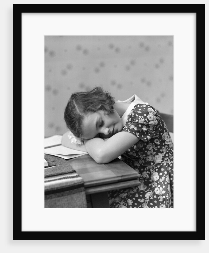 1930s Teenage Girl Sleeping Head Resting On Table Desk While Studying by Anonymous
