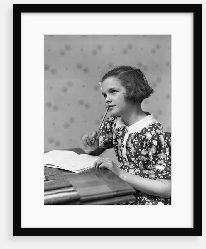 1930s Teenage Girl Thinking Sitting At Table Doing Homework by Anonymous