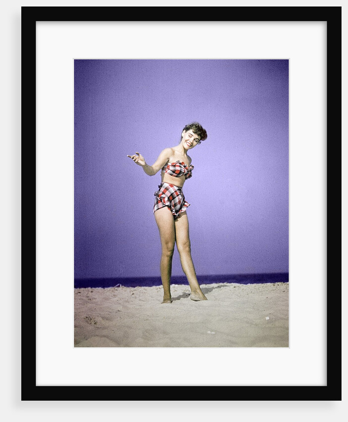 1940s 1950s Smiling Young Woman Wearing Plaid Two Piece Bathing Suit Standing On Beach Sand by Anonymous