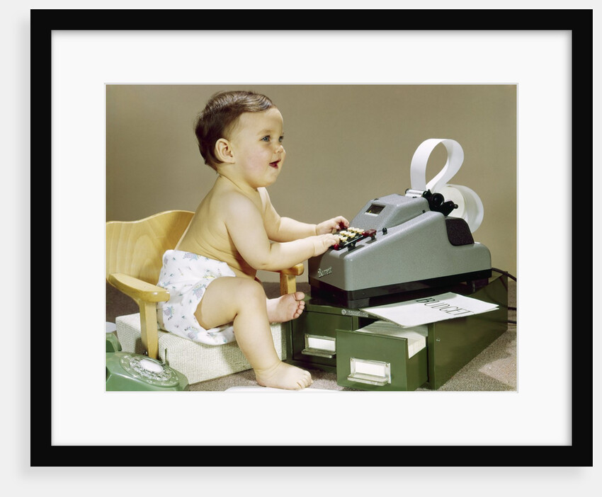 1960s Smiling Accountant Office Worker Baby Wearing Cloth Diaper Sitting In Chair Using Adding Machine Calculator by Anonymous