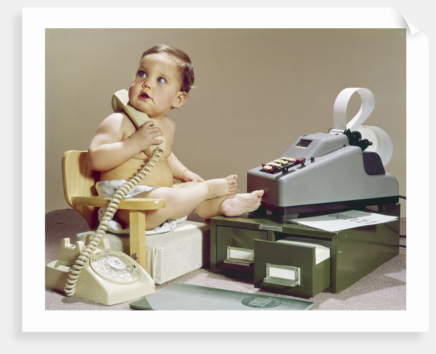 1960s Business Baby Sitting In Chair Holding Telephone With Calculator Adding Machine File Drawers Looking Back Over Shoulder by Anonymous