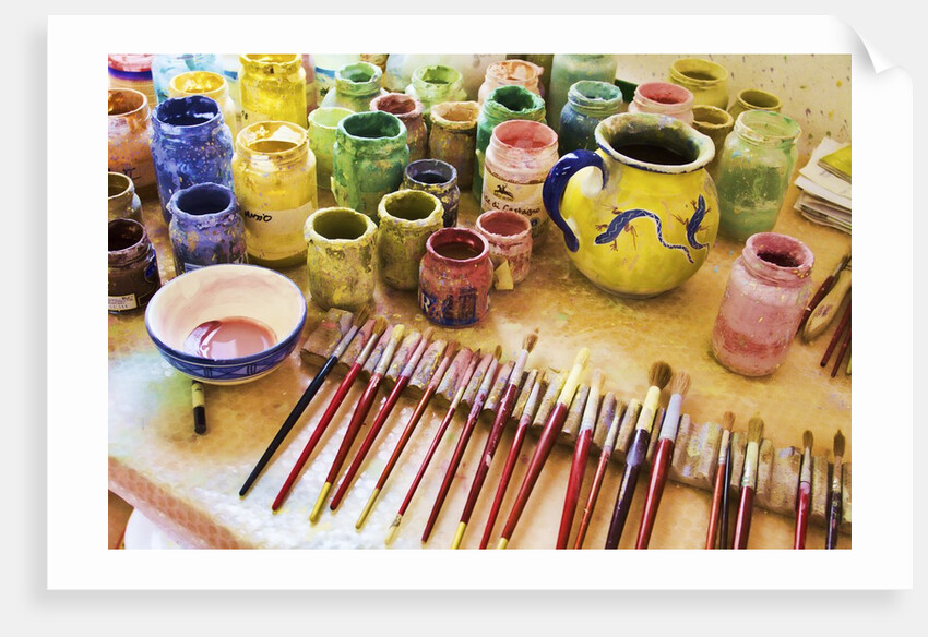 Paint brushes and colored paints by Anonymous