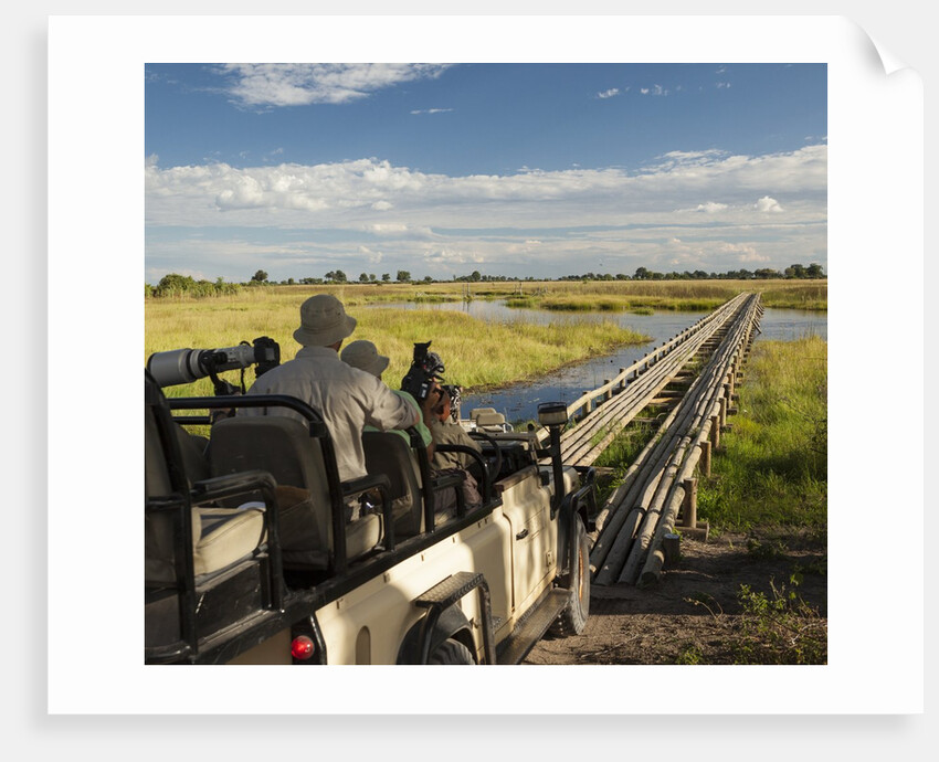 Safari Vehicle Crossing Bridge by Anonymous