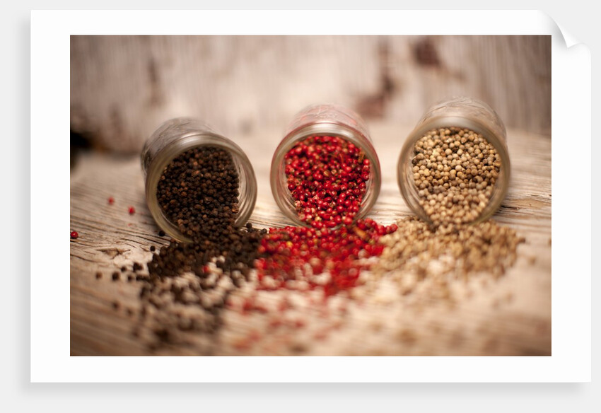 Black, red, and white pepper corns in rustic mason jars by Anonymous