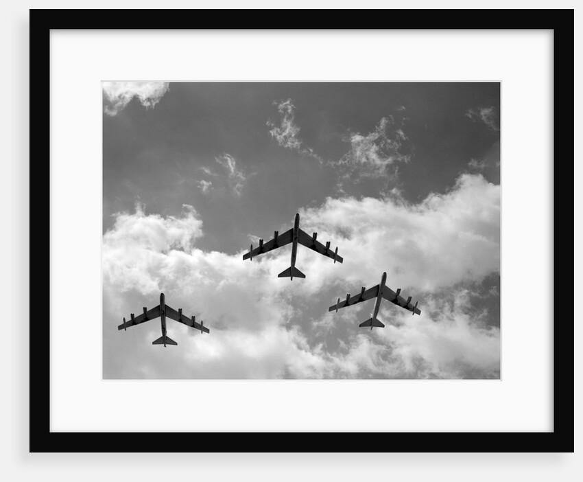 1950s three B-52 bomber airplanes in flight formation by Anonymous