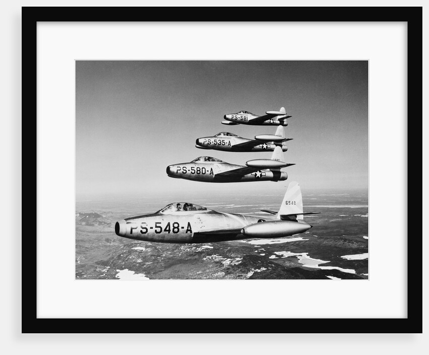 1950s four US air force F-84 thunder jet fighter bomber airplanes in flight by Anonymous