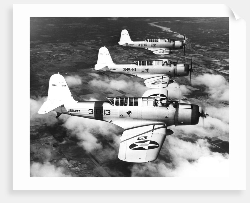 1940s three World War II US navy dive bombers flying in formation by Anonymous