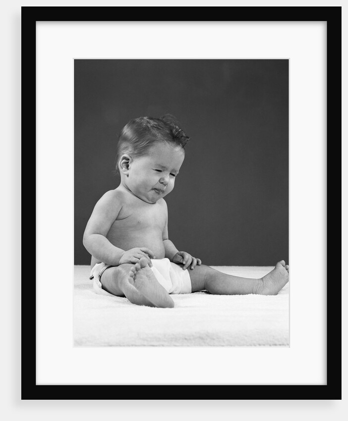 1950s baby wearing diaper and making a funny face by Anonymous