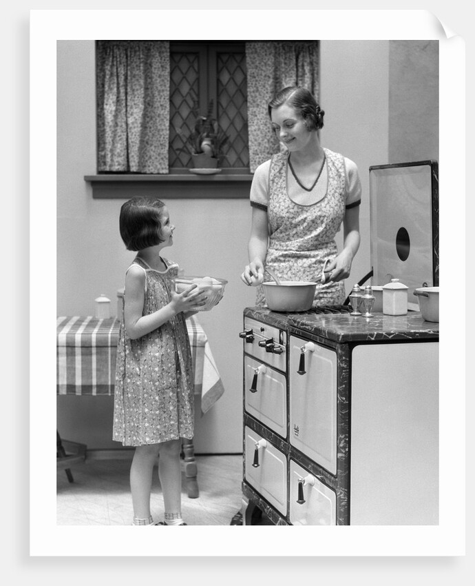 1920s young girl helping her mother to cook by Anonymous