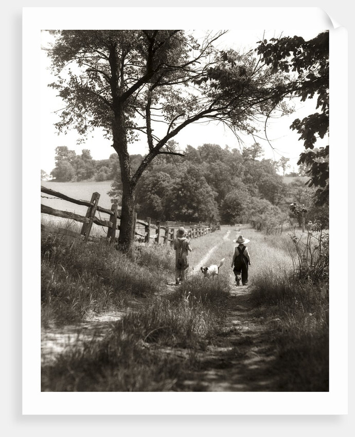 1930s boy and girl in straw hats walking down farm road by Anonymous