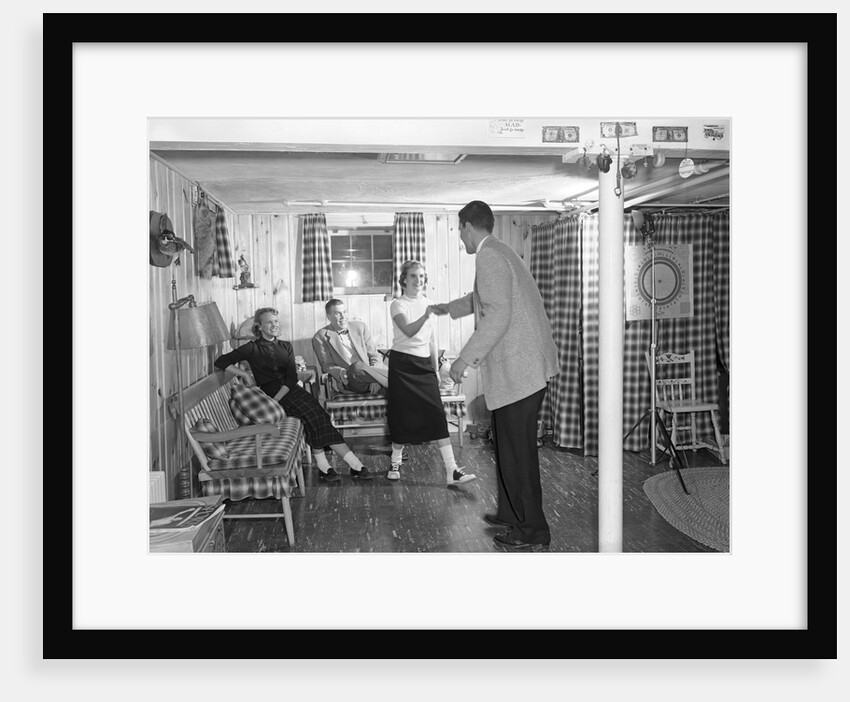 1950s teens in rec room dancing by Anonymous