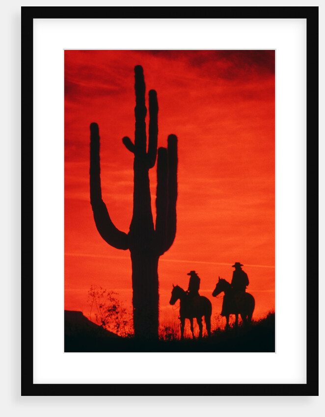 1980s silhouette of two anonymous cowboys riding on horseback by Anonymous