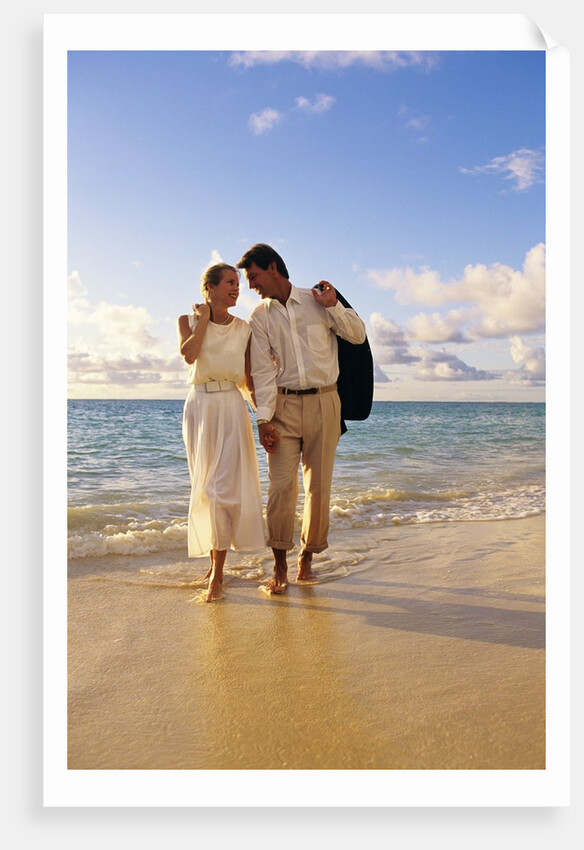 1980s 1990s couple walking on beach by Anonymous