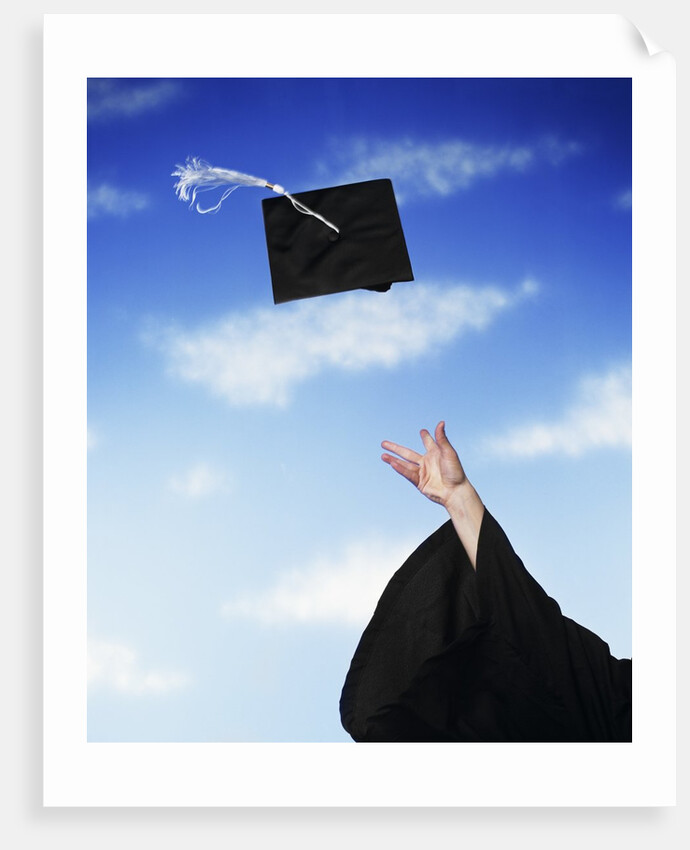 Graduate tossing mortarboard hat into the air by Anonymous