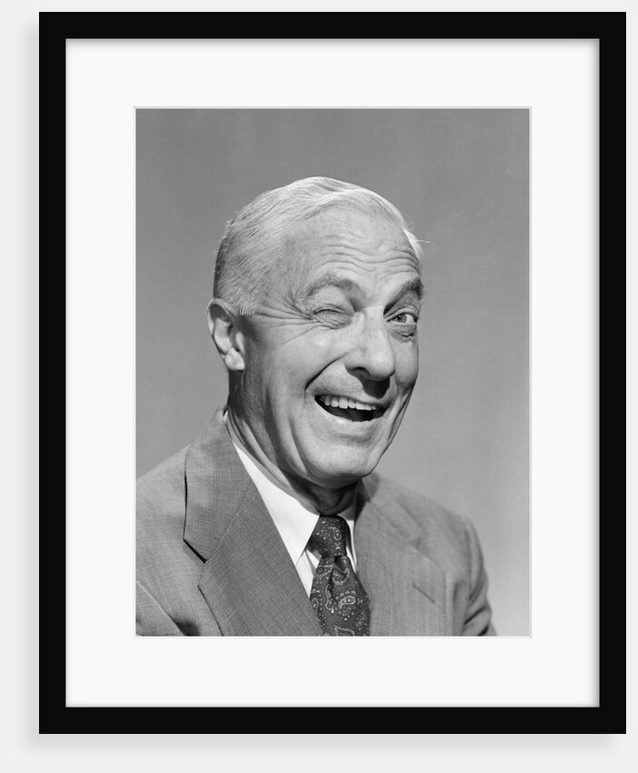 1950s senior businessman winking by Anonymous