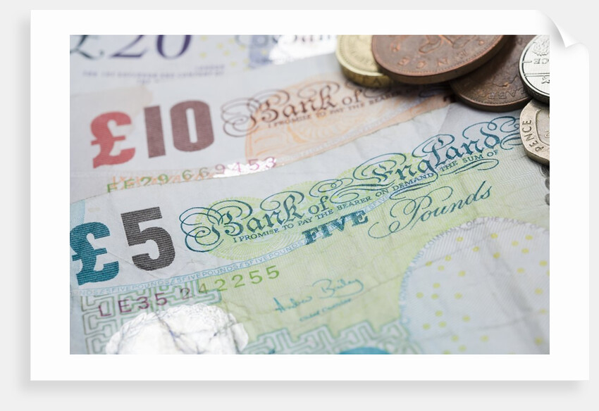 Paper money with change on a table by Anonymous