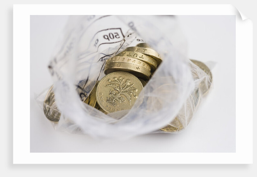 Looking down into an open money bag of pound coins by Anonymous
