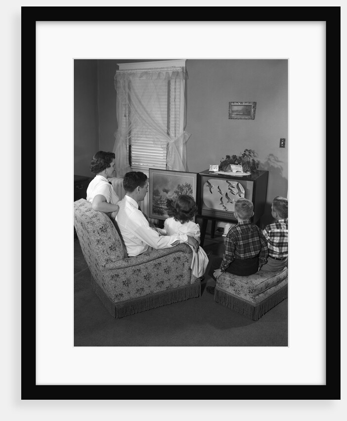 1950s family watching television by Anonymous