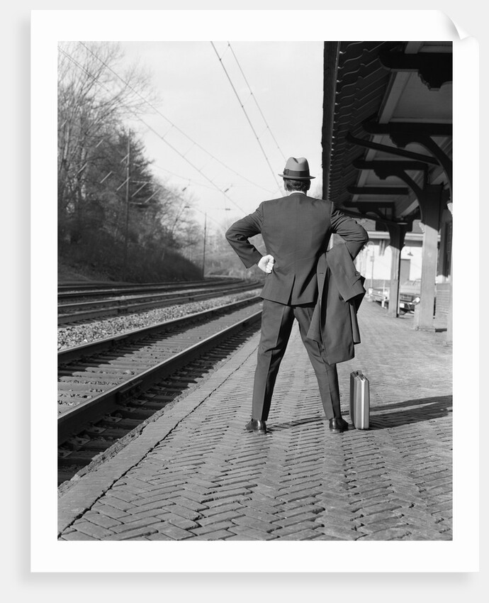 1950s 1960s man waiting for a train by Anonymous