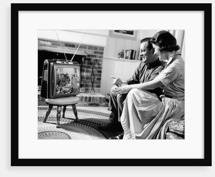 1950s couple watching television by Anonymous