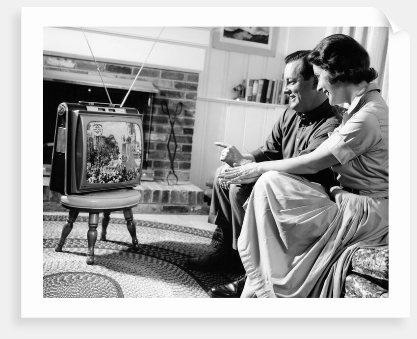 1950s couple watching television by Anonymous