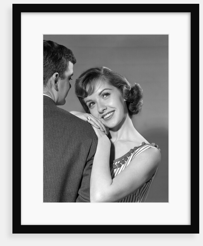 1950s woman resting on man's shoulder by Anonymous