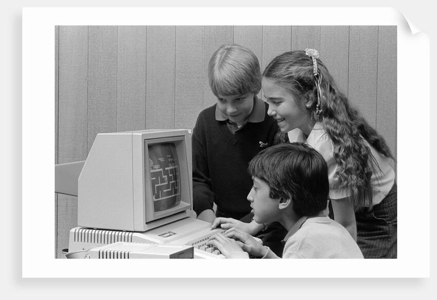 1980s boys and girl playing games on a computer by Anonymous
