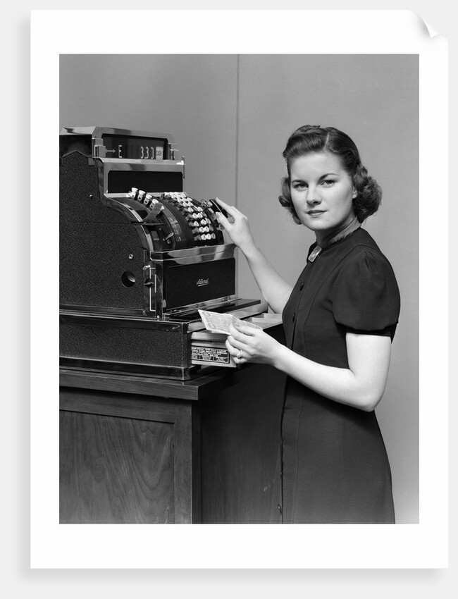 1930s 1940s portrait of female sales clerk at a cash register by Anonymous