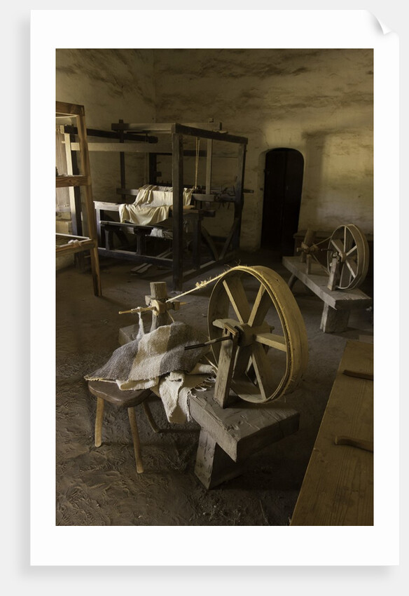 Spinning wheel and looms at La Purisima Mission in Lompoc California by Anonymous