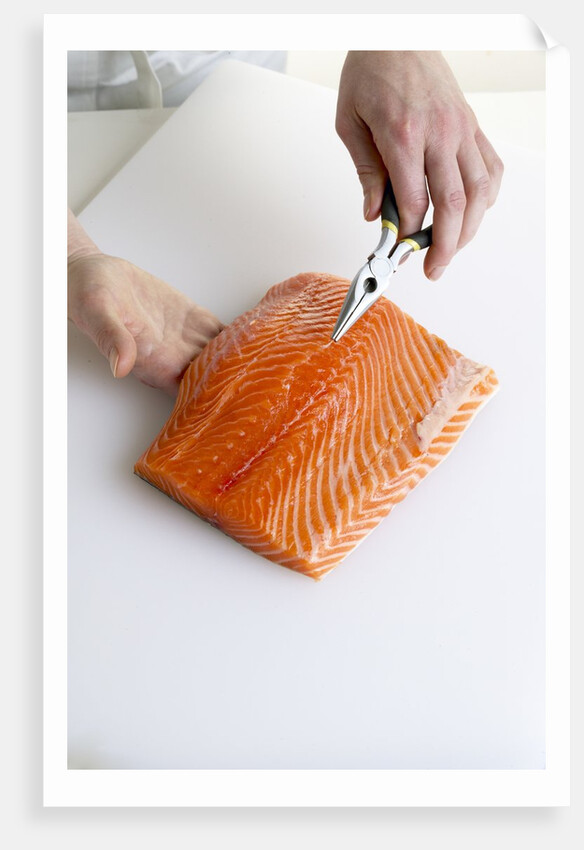 Deboning a salmon fillet by Anonymous