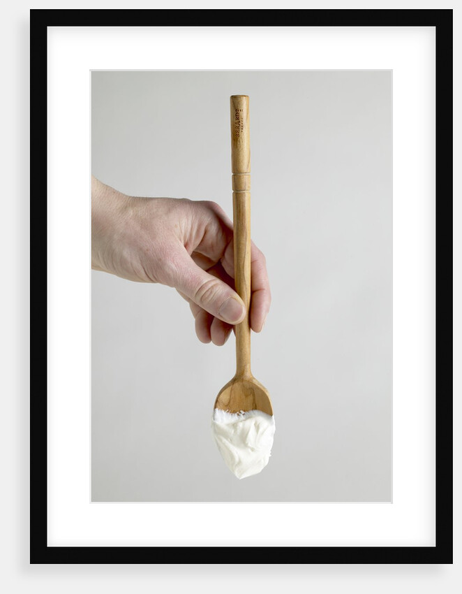 Spoon with yogurt by Anonymous