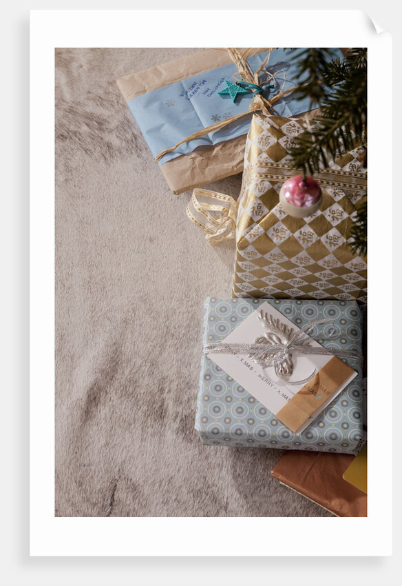 Gift boxes placed under Christmas tree, Munich, Bavaria, Germany by Anonymous