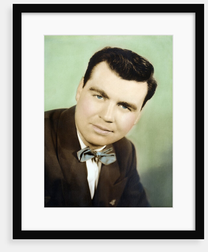 Mature man colorized studio portrait, ca. 1955. by Anonymous